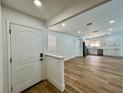 Bright living room featuring an open floor plan, wood floors and modern finishes at 6191 Bullion Blvd, Las Vegas, NV 89103
