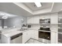 Modern kitchen with stainless steel appliances, light countertops, and white cabinets at 6250 W Flamingo Rd # 43, Las Vegas, NV 89103