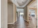 Grand foyer with hardwood floors and modern architectural details at 6311 Baker Creek St, Las Vegas, NV 89149