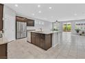 Bright kitchen featuring stainless steel appliances, granite countertops, and an island with sink at 7224 Anora St, North Las Vegas, NV 89084