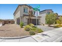 A beautiful two-story home with a well-manicured front yard and a two-car garage at 8261 Selenite St, Las Vegas, NV 89113