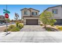 Charming two-story home featuring a well-maintained exterior, desert landscaping, and a paved driveway at 8261 Selenite St, Las Vegas, NV 89113