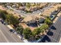 Aerial view of a home with a backyard pool in a suburban neighborhood at 8436 Kawala Dr, Las Vegas, NV 89128