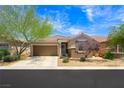 Charming single-story home featuring a well-maintained yard and attached two-car garage in a desirable community at 9104 Ashiwi Ave, Las Vegas, NV 89178