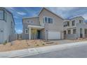 Contemporary home with a two-car garage and xeriscaped front yard at 10465 Smokey Mariposa, Las Vegas, NV 89166