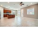 Open-concept living space featuring tile flooring, recessed lighting, and a view of the kitchen area at 208 Coltrane Canyon Ave, Henderson, NV 89011