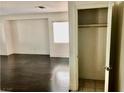 View of closet located near a spacious living room with dark wood floors at 224 Wicked Wedge Way, Las Vegas, NV 89148