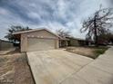 Single story house with a two car garage and a long driveway at 2450 Oak Glen Way, Las Vegas, NV 89115
