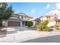 A beautiful two-story home with a two-car garage and a well-maintained front yard at 2608 Campobello Ave, North Las Vegas, NV 89081