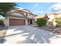 Lovely two-story home featuring an attached two-car garage and meticulous landscaping at 2608 Campobello Ave, North Las Vegas, NV 89081
