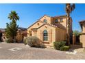 View of the property's facade highlighting its stucco exterior and desert landscaping at 33 Via Di Mello, Henderson, NV 89011