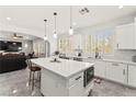 Bright, modern kitchen with a large white island, stainless steel appliances, and an open floor plan at 366 Rancho La Costa St, Las Vegas, NV 89138