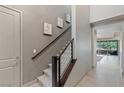 Carpeted staircase with modern metal railing, leading to the upper level of the home at 4290 Solace St, Las Vegas, NV 89135