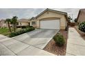 Attractive single-story house with a well-maintained front yard and driveway at 4713 Vista Del Rey Ct, North Las Vegas, NV 89031