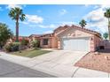 Lovely single-story home featuring a well-manicured front yard and two-car garage, set on a quiet street at 517 Casa Del Norte Dr, North Las Vegas, NV 89031