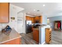 Well-equipped kitchen with stainless steel appliances, wood cabinets, and lots of counter space at 6121 Mission Gorge Ct, Las Vegas, NV 89130