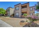 Two-story apartment complex features desert landscaping and private balconies at 6650 W Warm Springs Rd # 1083, Las Vegas, NV 89118