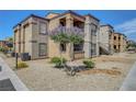 Two-story apartment complex with desert landscaping features stairways and private balconies at 6650 W Warm Springs Rd # 1083, Las Vegas, NV 89118