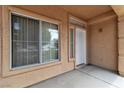 Inviting front porch with stucco walls, decorative columns, and ample natural light at 682 E Sole Addiction Ave, Las Vegas, NV 89183