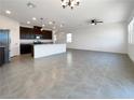 Spacious open-concept layout with sleek tile flooring, perfect for entertaining and modern living at 6918 Dandelion Park Ave, Las Vegas, NV 89113