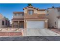 Charming two-story home with a desert landscaped yard and a covered entryway at 7240 Wandering Star Ct, Las Vegas, NV 89131