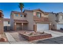 Two-story home with a two-car garage and desert landscaping at 7240 Wandering Star Ct, Las Vegas, NV 89131