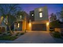 Modern two-story home with a two-car garage and well-maintained landscaping at 778 Horizon Canyon Dr, Henderson, NV 89052