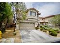 Attractive two-story house features manicured landscaping, a spacious driveway, and an attached two-car garage at 9144 Clear Sky Ave, Las Vegas, NV 89178