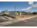 Cozy single-story home with a fenced yard, situated on a corner lot at 103 W Victory Rd, Henderson, NV 89015