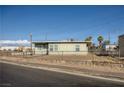 Inviting single-story home boasting a fenced yard and proximity to neighborhood amenities at 103 W Victory Rd, Henderson, NV 89015