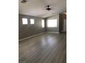 This living room is illuminated by natural light through the multiple windows at 10342 Spider Rock Ave, Las Vegas, NV 89135
