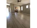 Light-filled living room features neutral colors and durable flooring at 10342 Spider Rock Ave, Las Vegas, NV 89135
