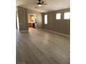Open living space with wood-look flooring, seamlessly connects to the kitchen at 10342 Spider Rock Ave, Las Vegas, NV 89135