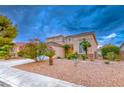 Beautiful two-story home with a well-maintained lawn, desert landscaping, and mature trees at 1367 Minuet St, Henderson, NV 89052