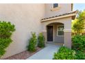 Inviting front entrance with an arched porch and landscaped surroundings, perfect for a warm welcome at 1433 Overseer Ave, Henderson, NV 89074