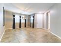 Spacious living room with tile flooring, neutral walls, and large windows for abundant natural light at 1433 Overseer Ave, Henderson, NV 89074