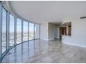 Bright, open living room features floor-to-ceiling windows offering panoramic city views and an adjacent kitchenette at 222 Karen Ave # 2308, Las Vegas, NV 89109