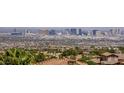 Sweeping city view showcases Las Vegas skyline over rooftops and mature palm trees at 2555 Hampton Rd # 7304, Henderson, NV 89052