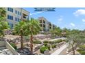 Beautiful condo building with landscaped grounds and walking paths in a resort-style community at 2555 Hampton Rd # 7304, Henderson, NV 89052