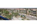 View of condo community with lush landscaping and convenient garage parking at 2555 Hampton Rd # 7304, Henderson, NV 89052