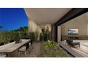 Stylish outdoor dining area with seating and view to living room, perfect for al fresco meals at 2655 Juniper Branch St, Las Vegas, NV 89117