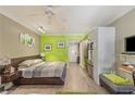 Open floor plan offers a kitchen, dining, and living area with a bright green accent wall at 30 Strada Di Villaggio # 429, Henderson, NV 89011
