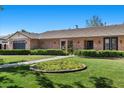 Well-maintained brick home with a manicured lawn and neat hedges at 3104 Conners Dr, Las Vegas, NV 89107