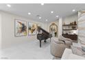 Stylish living room with a grand piano, art, and elegant furnishings at 3104 Conners Dr, Las Vegas, NV 89107