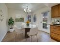 Cozy breakfast nook featuring a marble table and natural lighting at 3972 Tirana Way, Las Vegas, NV 89103