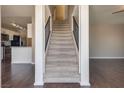 Entryway features an open staircase and views into the kitchen and living room at 500 Quail Bird Pl, Henderson, NV 89052