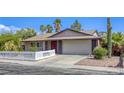 A charming single-story home featuring desert landscaping and a spacious two-car garage at 5132 Springland St, Las Vegas, NV 89146