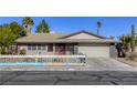 Charming single-story home with a two-car garage and unique fence at 5132 Springland St, Las Vegas, NV 89146
