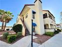 Exterior view of a two-story condo showcasing desert landscaping and private stairs at 6137 W Oakey Blvd # A, Las Vegas, NV 89146