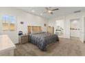 Spacious main bedroom with plush carpet, ensuite bathroom, and walk-in closet at 6980 W Meranto Ave, Las Vegas, NV 89178